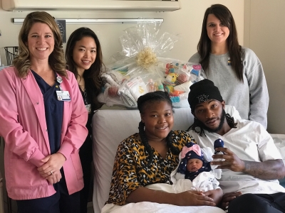 from left, are: Labor & Delivery Staff Registered Nurse Shannon Davis, Dr. Diana Dang, LaFrance, Clarielle, White and Nursery Certified Nursing Assistant Wintress McCormick.